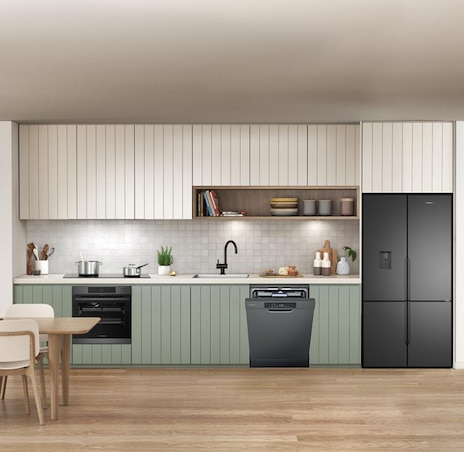 Efficient dishwasher stacking in a modern kitchen. 